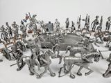 many figurines of different sizes and colors on the table