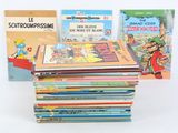 several children ' s books are stacked on top of each other