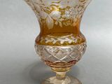 a glass vase that is sitting on a table