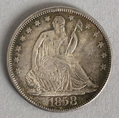 a close up of a coin on a white surface