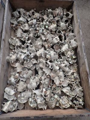 a wooden box filled with lots of silver objects