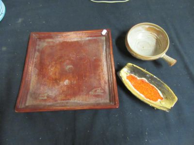 two bowls and a tray sitting on a table