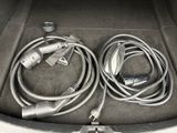two cables in the trunk of a car