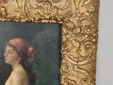 painting of a woman with a red headband in a gold frame