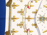 an image of a white and yellow scarf with a cross on it