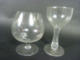 two wine glasses sitting next to each other on a table