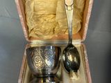 two spoons in a box with a spoon in it
