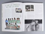 an open book with a picture of a soccer team on it