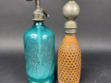 pair of antique blue glass bottles with brass fittings