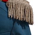 a close up of a uniform with a long fringe on it