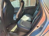the back seats of a car with the door open