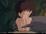 an animated image of a young boy holding a cat in front of him