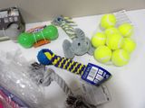 a lot of tennis balls and toys on the table
