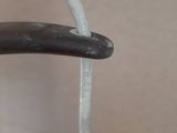a close up of a handle on a wooden chair