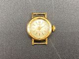 an image of a close up of a wrist watch on a table