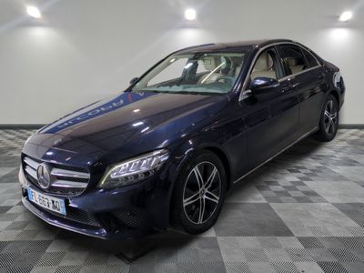 the mercedes c - class is parked on a checkered floor