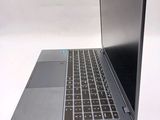 a laptop computer that is sitting on a white table