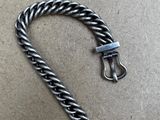 a close up of a metal chain with a clasp on it