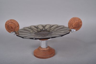 a glass bowl on a wooden stand on a white background