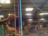 a man that is standing in a room with a kite
