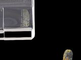 an image of a piece of glass with a rock inside of it