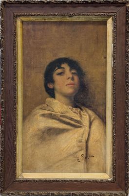 portrait of a woman in a white shawl by a red wall
