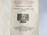 an open book with a black and white image of a bird on it