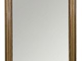 a gold framed mirror on a white background