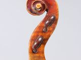 an old violin with a wooden back and a wooden bow