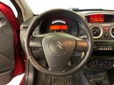 the interior of a car with a steering wheel and dashboard controls