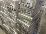 boxes stacked on top of each other on a pallet in a warehouse