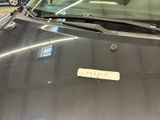 a car that has a sticker on the hood of it