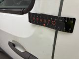 a car with a measuring tape on the side of it