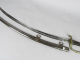 a pair of two swords, one of which has been cut in half