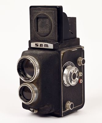 an old camera that is sitting on a table