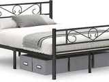 the bed frame is made of metal and has two drawers underneath it