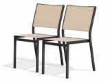 a pair of black and beige chairs on a white background