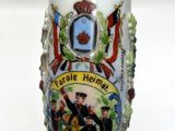 a glass vase with a picture on it sitting on a table
