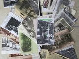 a pile of old photos on the floor of a room