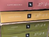 several boxes of coffee are stacked on top of each other