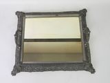 a mirror hanging on the wall in a room