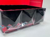 a black box that has a red and black design on it