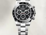 rolex watch with a black dial on a stainless steel bracelet