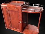 a wooden bar cart with a glass top and a metal shelf