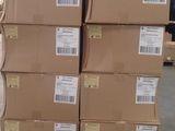 a large stack of boxes sitting on a pallet in a warehouse
