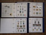 several different types of stamps are displayed in a binder on a table