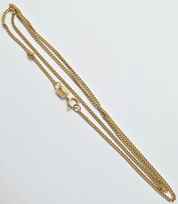 a gold chain bracelet with a clasp on a white background