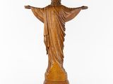 a wooden statue of jesus on a white background