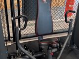 a gym equipment set up in front of a chain link fence