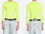 an image of a man wearing a neon green shirt and jeans